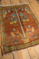 Angled view showcasing the nuanced Tree of Life design on an antique Persian Tabriz square mat.