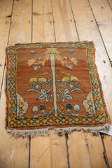 Antique Tabriz collector rug mat viewed flat, showcasing the full tree of life design and pawn motif border.