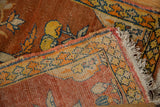 Corner detail of an antique Tabriz showing the hand-knotted pile, fringe, and polychrome selvage wrap.