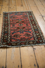 Lilihan rug's dusty raspberry field, with gem-tone blue vinery and floral palmettes.