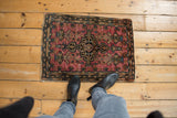 A vintage Farahan Sarouk rug mat shown from above to illustrate its scale.
