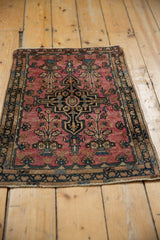 High-angle view of a vintage Farahan Sarouk rug showing its square form and dramatic central medallion.