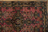 Detail of the serpent-inspired and meandering floral vine borders on a Farahan Sarouk mat.