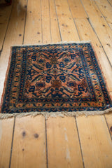 Lilihan rug's finely woven border with terracotta rose, cobalt blue floral pattern, and fringe.