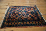 Nuanced cobalt blue floral border and partial fringe detailing on a vintage Lilihan rug.