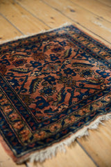 Fine Lilihan rug weave; terracotta rose, cobalt floral, and serrated leaf details.