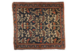 Vintage Persian Farahan Sarouk square rug with deep indigo, beige plant motifs, red border.