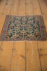 Vintage Farahan Sarouk rug: deep indigo field, beige serrated blossoms, red and blue vine border.