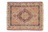 Antique Kerman rug with a starburst medallion, rose florals, and distinct purple selvages.