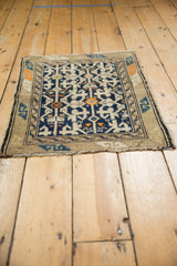 Vintage Caucasian rug showing serpentine border and bold geometric field design.