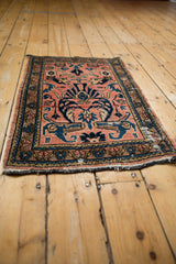 Vintage Lilihan rug mat with faded raspberry field, sprawling cobalt blue palmettes, and floral borders.