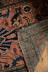 Vintage Lilihan rug's faded pile, machine bound end, and hand-knotted foundation.