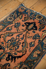 Vintage Lilihan rug corner showing layered boteh blossoms on an apricot field and navy border.