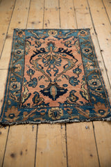 Intricate floral palmette and dramatic blossoms on pale apricot and blue vintage Lilihan rug.