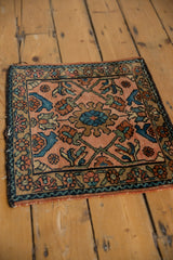 Lilihan rug corner showcasing sapphire blue, dusty rose, and oxidized green floral vinery.