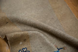 Detailed texture of the low pile and hand-knotted wool foundation of an antique Peking rug.