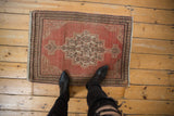 Distressed Senneh rug detail, dusty copper Herati field, even wear, faint foundation.