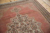 Distressed vintage Senneh rug, worn terracotta abrashed field, ivory Herati medallion.