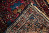 Hand-knotted vintage Lilihan rug foundation, showing side cord selvage and raspberry, sapphire colors.