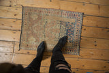 Distressed vintage Tabriz prayer rug section, worn pile texture, ivory, pale rust, navy motifs.