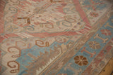 Geometric floral patterns on a distressed vintage Soumac rug showing rich abrash.