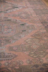 Vintage Distressed Soumac carpet featuring intricate geometric patterns in dusty blush and charcoal.