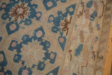Close-up of distressed Soumac weave, indigo field with serrated leaf and wave borders.