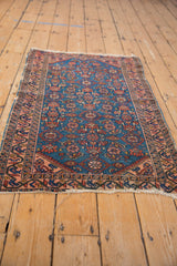Vintage Malayer rug side: Sapphire blue Herati motif field, pale raspberry curvilinear border.