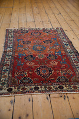 Fine antique Malayer rug: detailed Harshang field in madder root red and sapphire blue, with even wear.