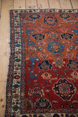 Antique Malayer rug: meandering vine border, colorful botehs, and cherry red Harshang field.