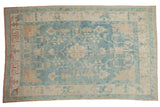 Distressed vintage Oushak rug featuring powder blue, ivory, and terracotta floral vinery, 6'1
