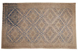 Distressed vintage Soumac carpet with allover lattice medallions, floral bouquets in beige, cobalt blue, and warm brown, 6'3
