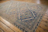 Scalloped cobalt blue lattice pattern with faded beige abrashes on a vintage Soumac carpet.
