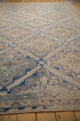 Distressed vintage Caucasian Soumac with geometric blue lattice pattern.