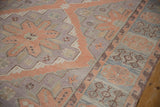 Distressed Soumac flat-woven texture showing powder blue, terracotta border motifs.