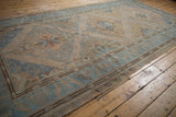 Distressed vintage Caucasian Soumac runner, showing main border with perched birds and geometric field.