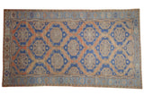 Distressed Vintage Soumac carpet with terracotta, blue, and beige geometric medallions, 6'3