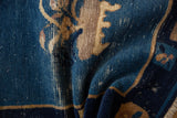 Antique Peking rug with cobalt blue pile wear revealing underlying beige foundation.