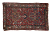 Distressed vintage Mehrivan rug, black cherry red, with stepped medallions and floral patterns, 3'3
