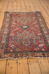 Distressed vintage Mehrivan rug showcasing stepped medallions, muted cherry red, blue floral field.