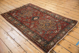 Distressed vintage Mehrivan rug showing its secure side, patterned border, and intact cord selvage.