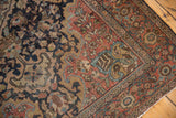 Distressed Farahan Sarouk rug corner detail with curvilinear blossoms and soft blush, navy tones.