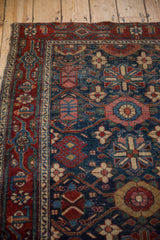 Vintage Fine Malayer rug corner, aged navy, red, blush floral field and vinery border.