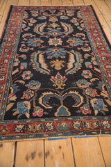Vintage Bibikabad rug detail: navy blue field, dramatic Herati-style floral blossoms in sapphire, blush, and jade.
