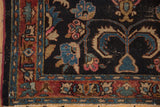 Vintage Bibikabad rug corner: navy field with blue floral motifs, burgundy border, visible pile wear.