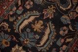 Bibikabad rug detail: navy ground with sapphire, blush, and green serrated florals, subtle patina.
