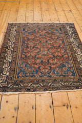 Ivory fringe and intricate reciprocating pawn motif on worn vintage Malayer rug border.