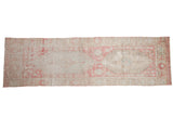 Distressed Oushak runner with faded blush pink and ivory floral medallion design, 3x10.