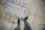 A personal view of the distressed texture and low pile of a vintage Turkish Oushak carpet.