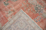 Distressed vintage Sparta rug showing dusty terra cotta pile and tightly hand-knotted foundation.